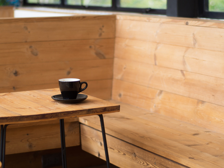 Coffee cup on the wood table Feel lonelyの写真素材
