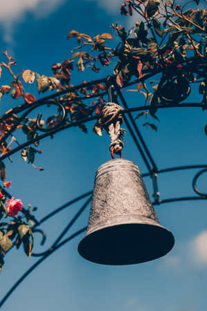 Bell hanging a hoop in the garden