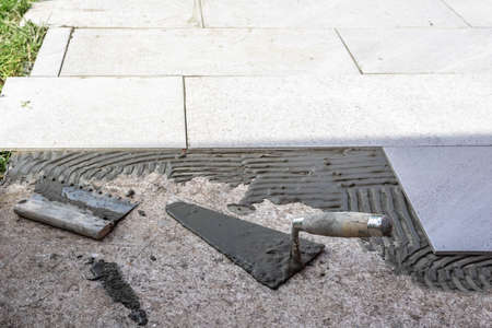 Tile installation with glue on concrete floor