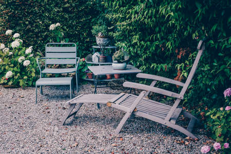 Long chair and table in the garden