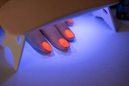 Nail polish with UV drying. Manucure feminine beautyの写真素材