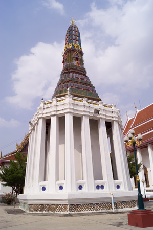 Pagoda and lamppost at Buddhist temple in Bangkokの写真素材