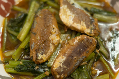Thai and Chinese food: fried clam, canned fish and Chinese mustard greenの写真素材