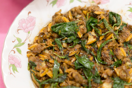 Thai and Chinese food: fried clam, canned fish and Chinese mustard greenの写真素材