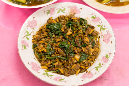 Thai and Chinese food: fried clam, canned fish and Chinese mustard greenの写真素材