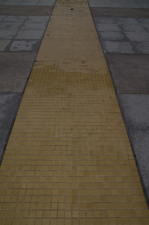 yellow tile paved on floorの写真素材