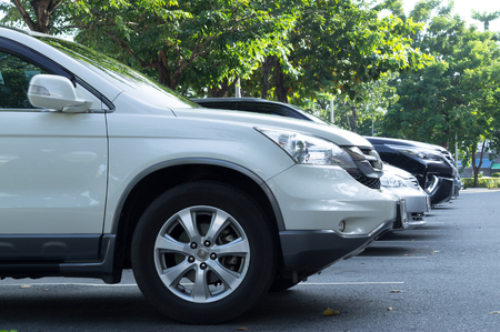 several cars park in front of department storeの写真素材