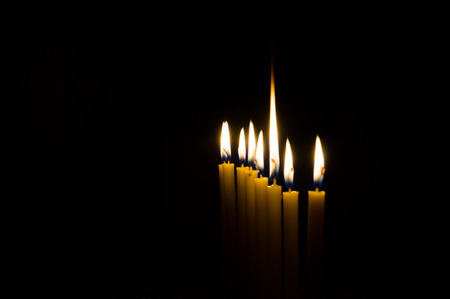 marvelous candle light on dark background to help lead people to the goalの写真素材