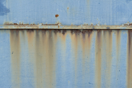 Rust on different colors iron background: Rust on grey, red and blue iron backgroundの写真素材