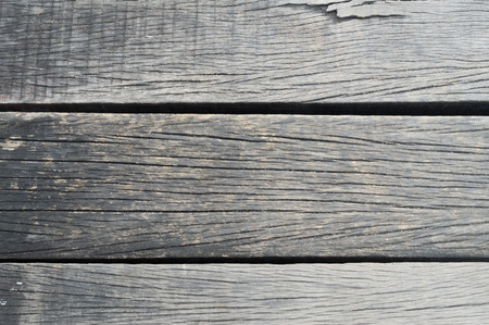 Old cream or grey wooden background with holeの写真素材