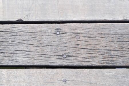 Old cream or grey wooden background with hole