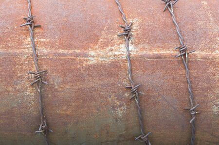 Rust on iron plate background or texture with barbed wire