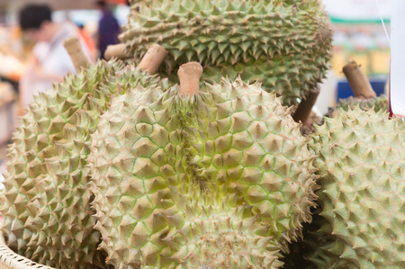 Ripe durians on sale in pile in supermarket, delicious durians, king fruit, sweet durians, healthy...