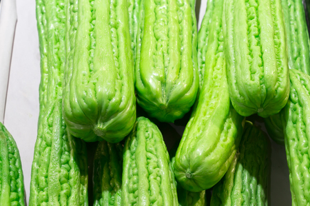 Green Momordica charantia on sale in supermarket, Green Momordica charantia is good for health, Green Momordica charantia background, healthy Green Momordica charantiaの写真素材