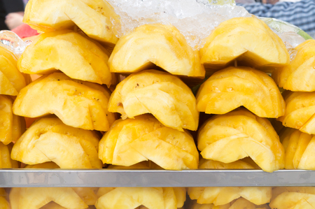 peeled pineapple in half soaked in ice, healthy sweet ripe pineappleの写真素材