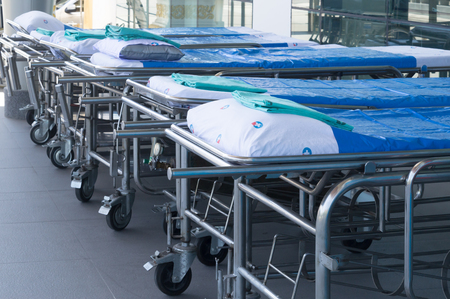 A group of stretchers before a hospital, stretchers in front of a hospital preparing for patientsの写真素材