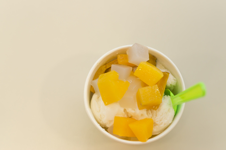 Ice cream with some ingredients is in a small beautiful cup, isolated image of ice creamの写真素材
