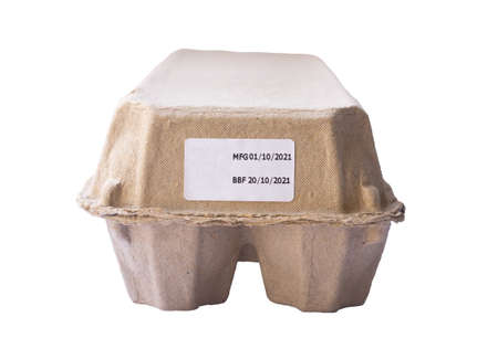 a dozen of eggs in closed carton box with production and expire dates is isolated on white...
