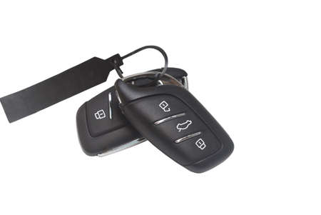 A remote control set of digital car key with unlockable and lockable buttons is isolated on white...