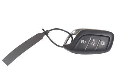 A remote control set of digital car key with unlockable and lockable buttons is isolated on white...