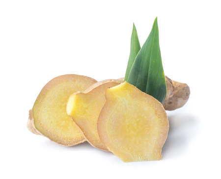 Fresh ginger with slices and leaves is isolated on white background