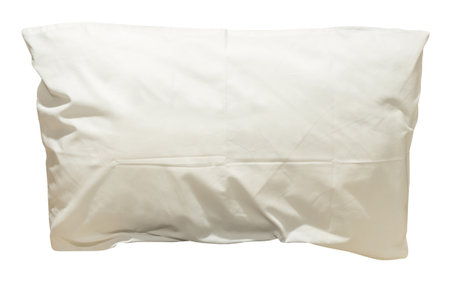 White pillow with case after guest's use at hotel or resort room is isolated on white background with clipping path. Concept of confortable and happy sleep in daily lifeの写真素材