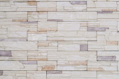 Cream stonewall with hirizontal pattern is used for background texture in decorative art work