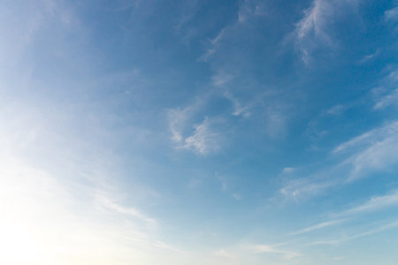 Beautiful blue and yellow sky with strange shape of clouds in the morning or evening was taken at...