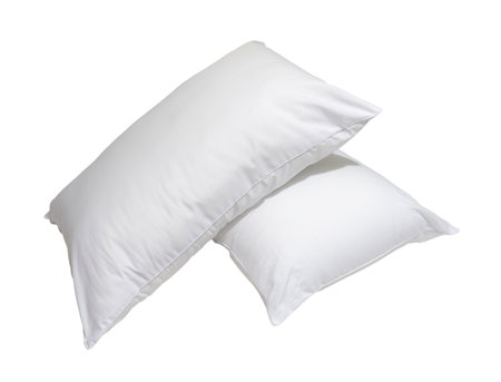 White pillows in stack in hotel or resort room are isolated on white background with clipping path. Concept of confortable and happy sleep in daily lifeの写真素材
