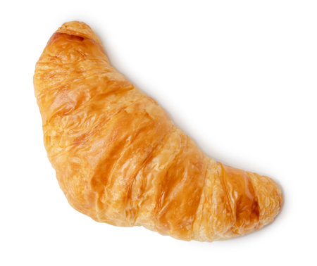 Top view of single croissant is isolated on white background with clipping path.の写真素材