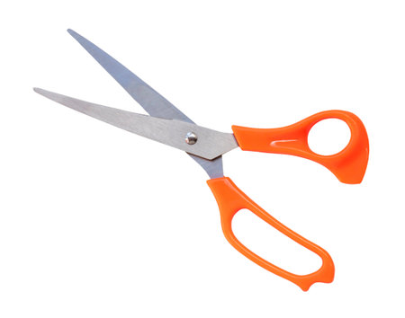 Multipurpose scissors with orange handle is isolated on white background with clipping path.の写真素材