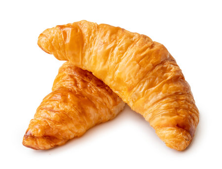 Two pieces of croissant in stack are isolated on white background with clipping path.の写真素材