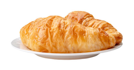 Two pieces of croissant in stack in white plate are isolated on white background with clipping path.の写真素材