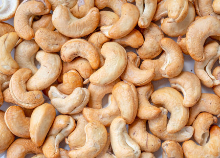 Delicious roasted brown cashew nut is used as snack background texture.の写真素材