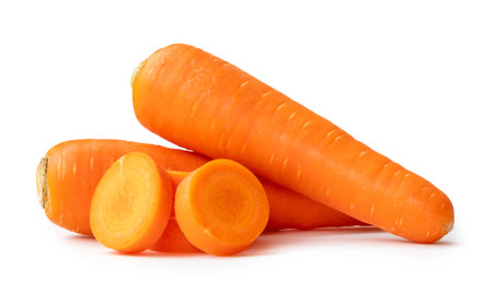 Two beautiful fresh orange carrots with slices in stack are isolated on white background with clipping path. Close up of healthy vegetable rootの写真素材