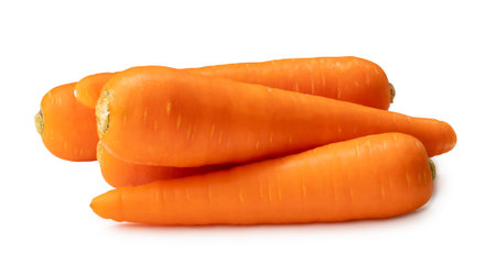 Fresh beautiful orange carrots in stack are isolated on white background with clipping path. Close up of healthy vegetable rootの写真素材