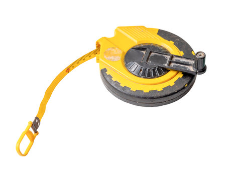 Old dirty yellow tape measure with scale is isolated on white background with clipping path.の写真素材