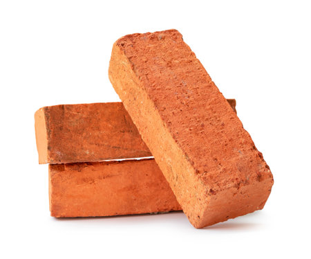 Cracked old red or orange bricks in stack are isolated on white background with clipping path.の写真素材