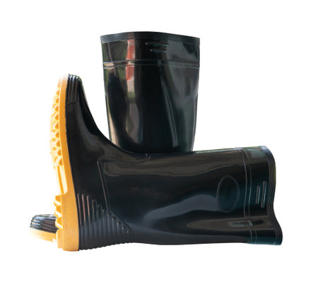 Side view of black gumboots or black rubber boots for working in garden is isolated on white background with clipping path.の写真素材
