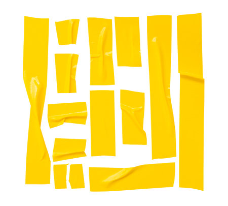 Top view set of wrinkled yellow adhesive vinyl tape or cloth tape in stripe shape is isolated on...