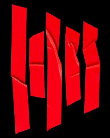 Top view set of wrinkled red scotch tape or adhesive vinyl tape in stripes is isolated on black background with clipping path.の写真素材
