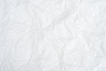 Top view and full frame of wrinkled or crumpled white paper texture is used as crumpled white paper background texture in decorative art work.の写真素材