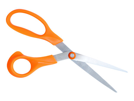 Inclined medium open multipurpose scissors with orange handle is isolated on white background with clipping path.の写真素材