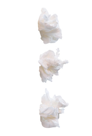 Side view set of screwed or crumpled white tissue paper balls is isolated on white background with...
