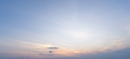 Low angle view and full frame of beautiful morning or evening blue and orange sky with cloudy while sunsets or sunrises was taken at the sea used as natural blackground textureの写真素材