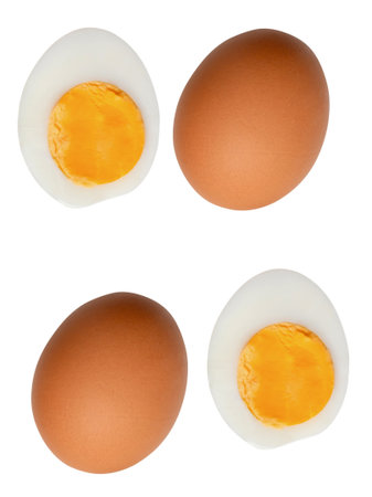 Top view set of two raw brown chicken eggs and two boiled or cooked eggs in two halves with egg yolk...