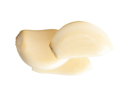 Top view of peeled garlic cloves in stack is isolated on white background with clipping path.の写真素材