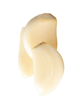 Top view of peeled garlic cloves in stack is isolated on white background with clipping path.の写真素材