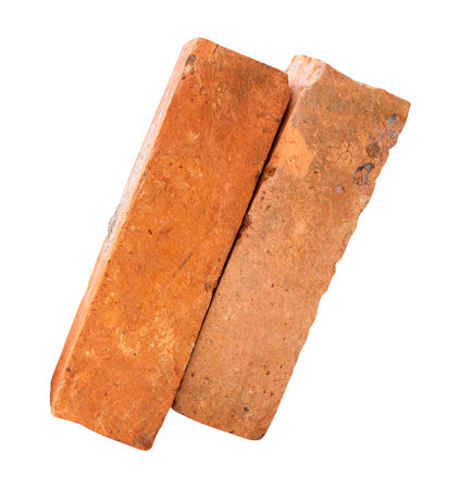 Side view of two cracked old red or orange bricks in stack is isolated on white background with clipping path.の写真素材