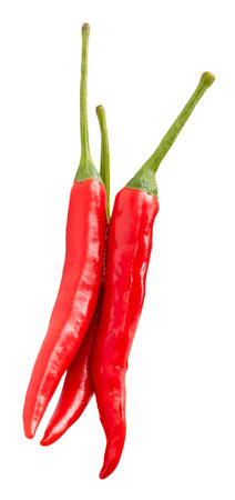 Top view of fresh red chili peppers or cayenne peppers in stack is isolated on white background with clipping path.の写真素材